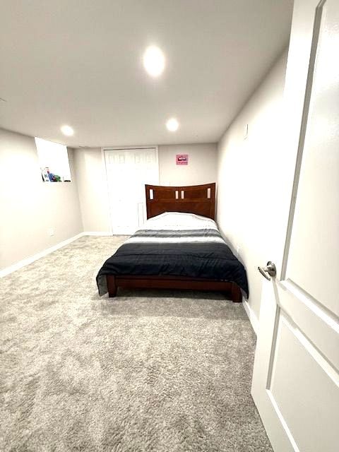 bedroom featuring baseboards, carpet flooring, and recessed lighting