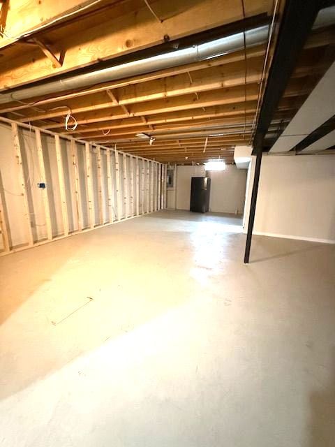 unfinished basement with water heater