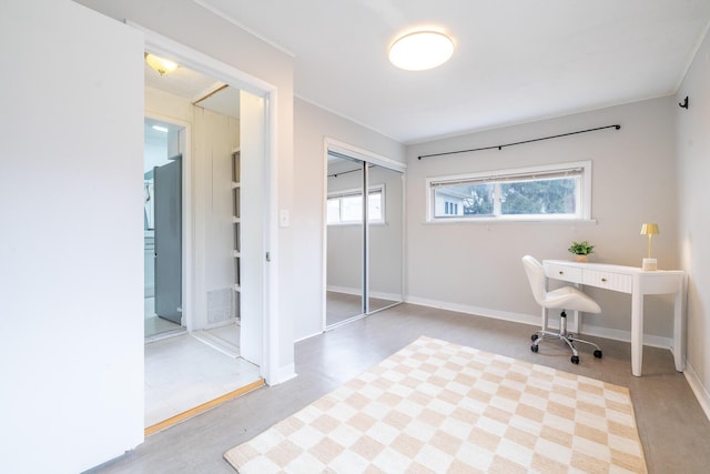 office space with baseboards and ornamental molding