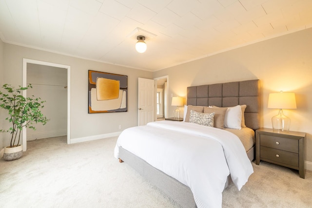 bedroom featuring light carpet, baseboards, a closet, and ornamental molding