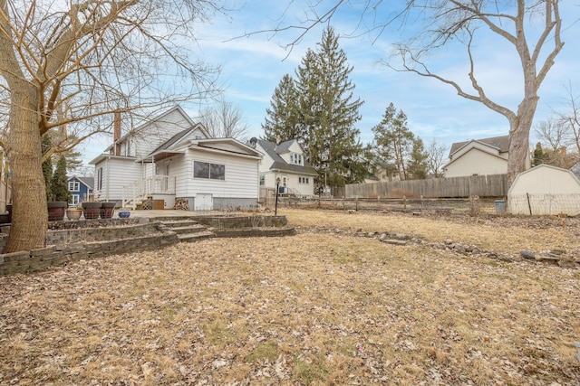 back of property with fence