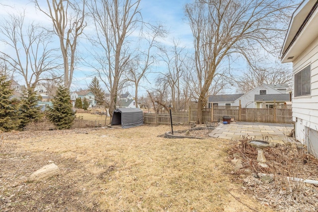 view of yard featuring a patio area and a fenced backyard