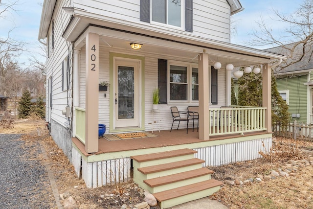 entrance to property featuring covered porch