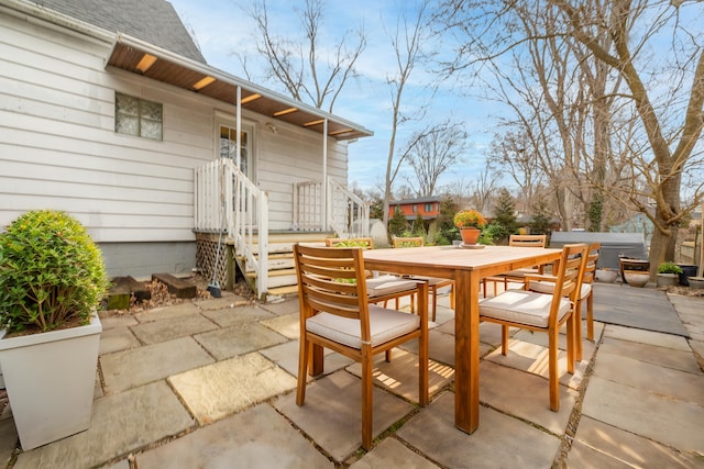 view of patio featuring outdoor dining area