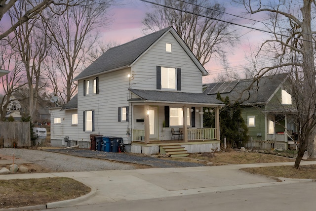 view of front of house featuring a porch and a shingled roof