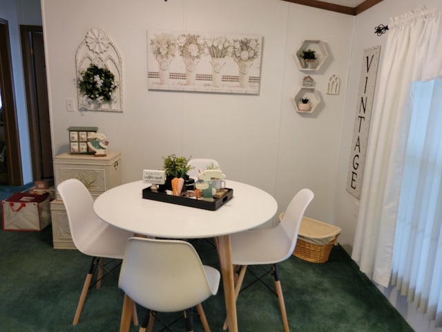 view of carpeted dining area