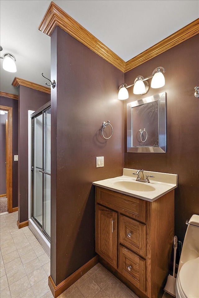 full bath featuring ornamental molding, a stall shower, vanity, and toilet