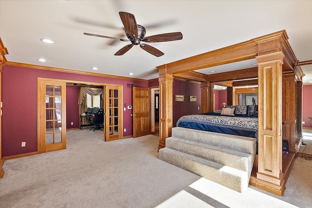 bedroom with decorative columns, baseboards, crown molding, french doors, and carpet floors