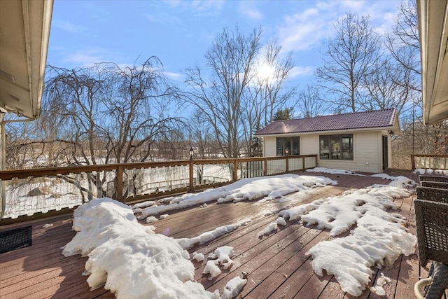 view of snow covered deck