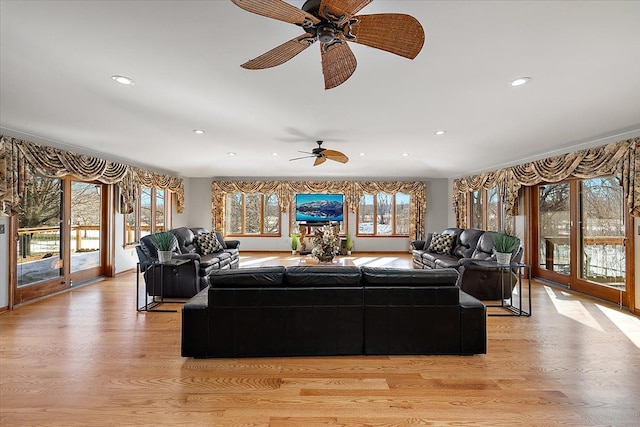 living room featuring light wood-style flooring and recessed lighting