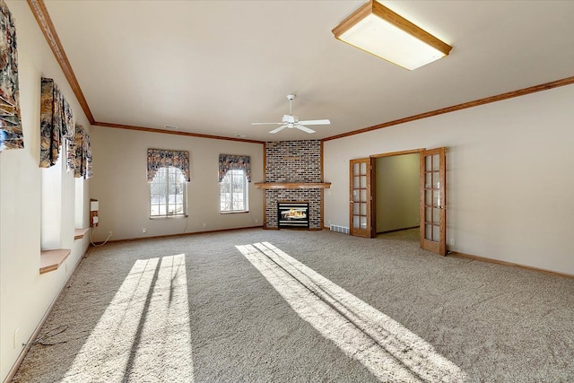 unfurnished living room featuring french doors, visible vents, crown molding, and baseboards