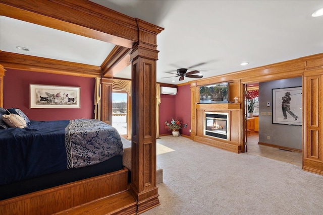 carpeted bedroom featuring decorative columns, ornamental molding, access to outside, a wall mounted air conditioner, and a multi sided fireplace