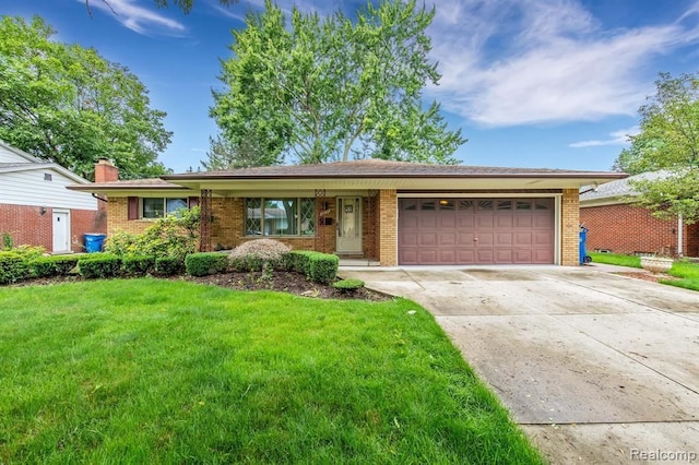 ranch-style home with a front lawn, brick siding, driveway, and an attached garage