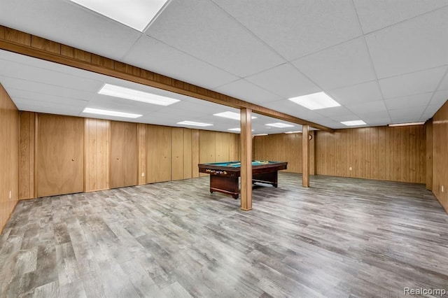 playroom featuring pool table, wood finished floors, a paneled ceiling, and wooden walls