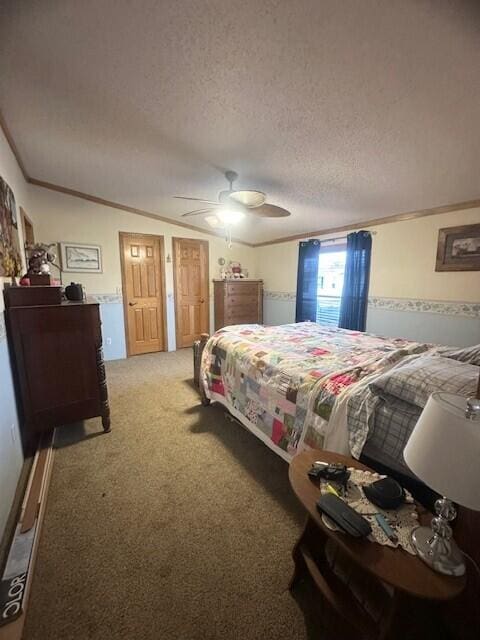 bedroom featuring light carpet, a ceiling fan, ornamental molding, and a textured ceiling