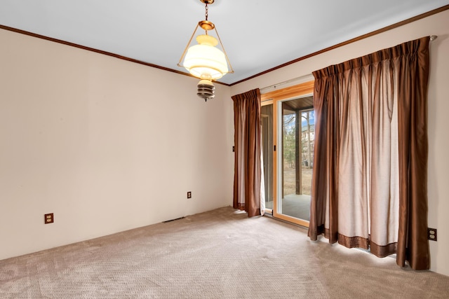 carpeted spare room with ornamental molding