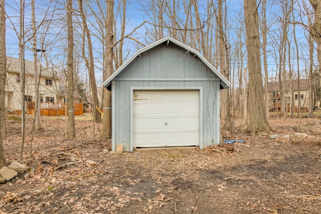 detached garage featuring driveway