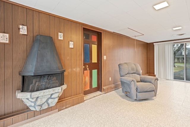 interior space with wood walls and tile patterned floors