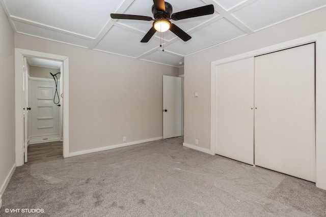 unfurnished bedroom featuring carpet floors, a closet, connected bathroom, and baseboards