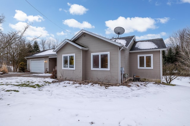 single story home with a garage and central AC