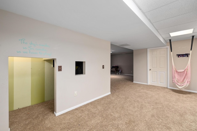 interior space with carpet floors and baseboards