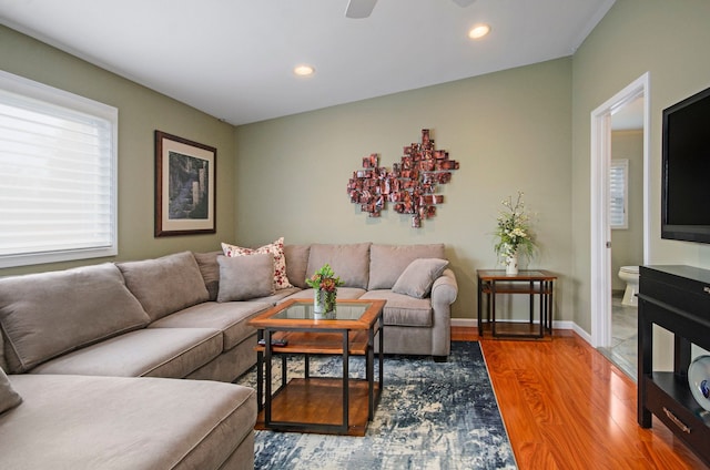 living area with recessed lighting, baseboards, wood finished floors, and a ceiling fan