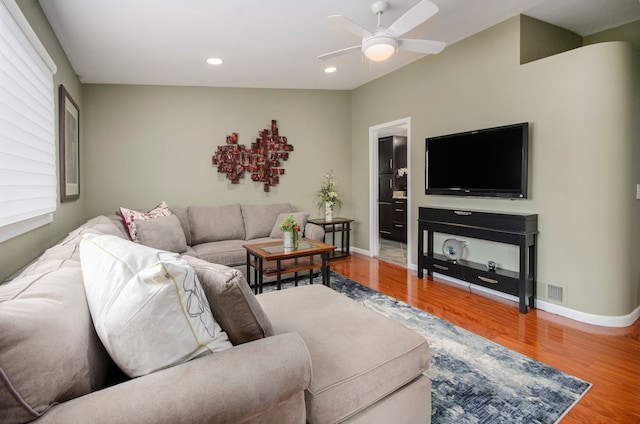 living room with recessed lighting, baseboards, wood finished floors, and a ceiling fan