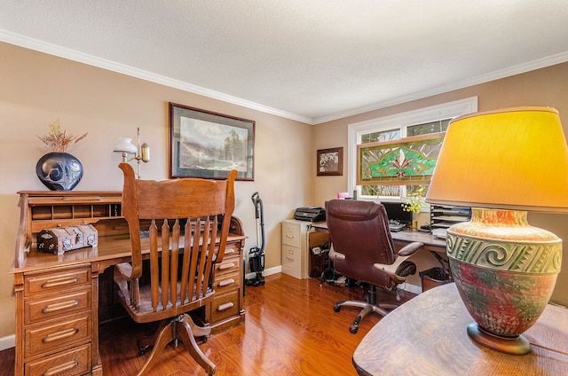 home office featuring a textured ceiling, wood finished floors, and ornamental molding