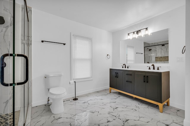 bathroom featuring marble finish floor, a sink, a marble finish shower, and double vanity