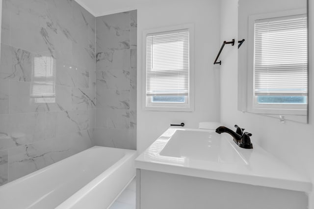 bathroom featuring marble finish floor and vanity