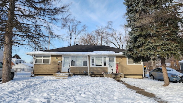 view of front of house with entry steps and fence