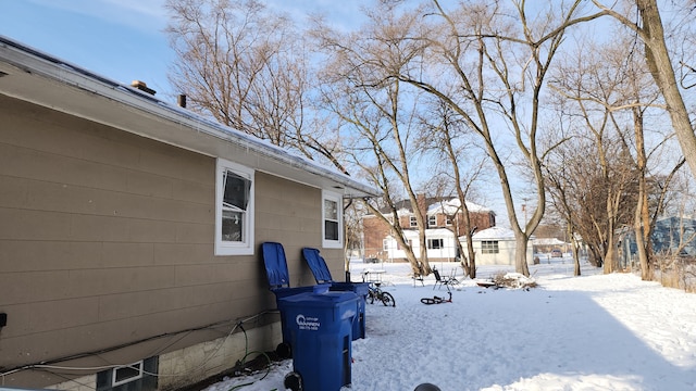 view of yard layered in snow