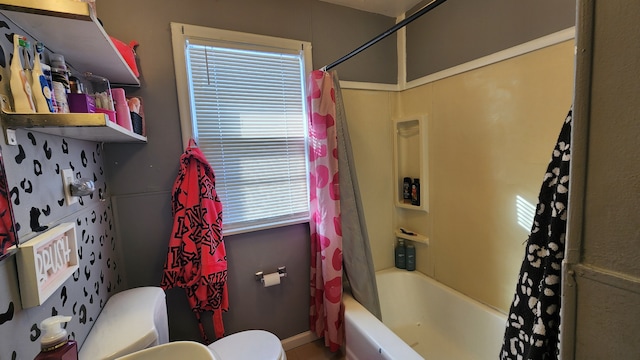 full bath featuring shower / tub combo and toilet