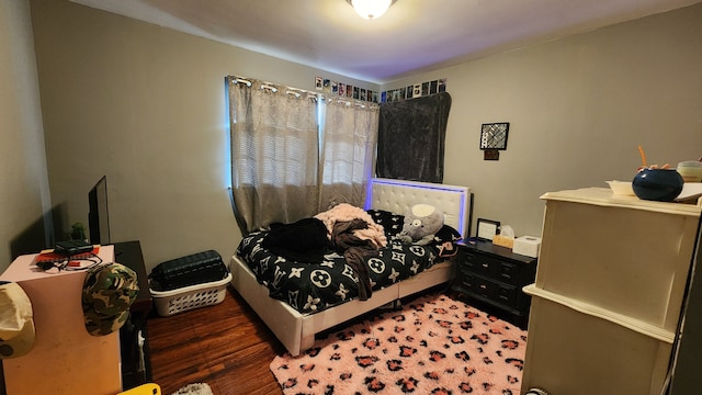 bedroom featuring wood finished floors