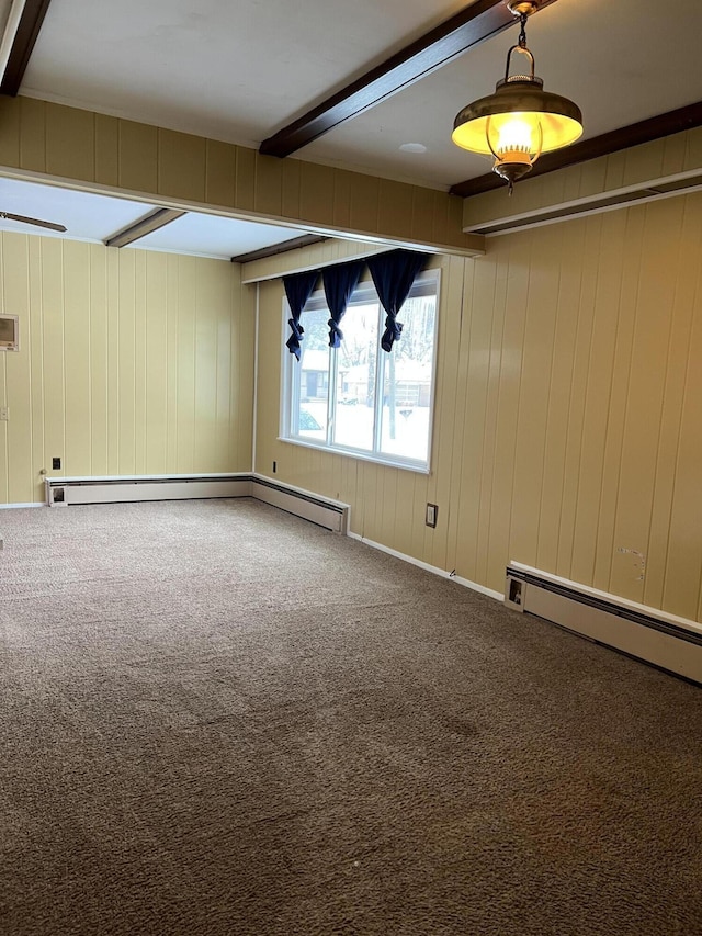 carpeted empty room with a baseboard radiator and beamed ceiling