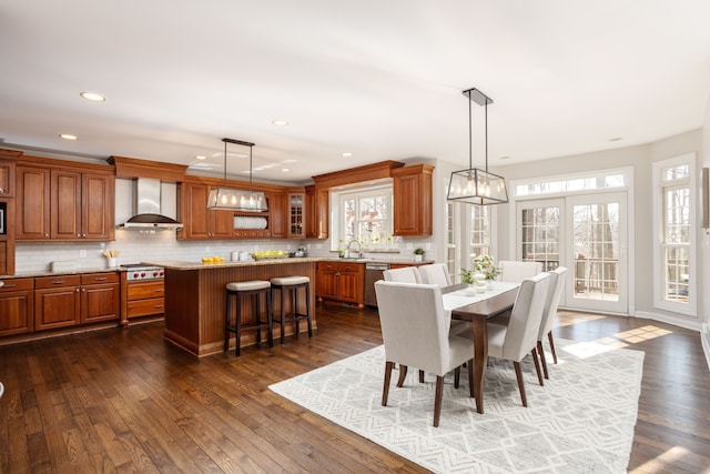 dining space with recessed lighting and dark wood-style flooring