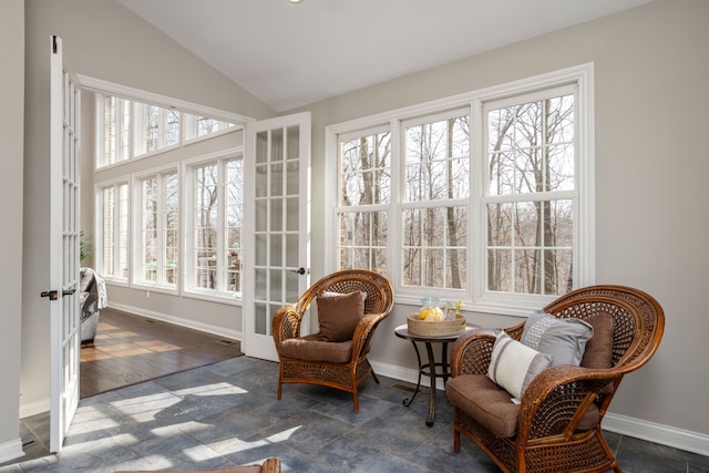 sunroom / solarium featuring vaulted ceiling