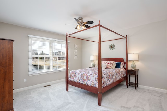 bedroom with carpet flooring, baseboards, visible vents, and ceiling fan