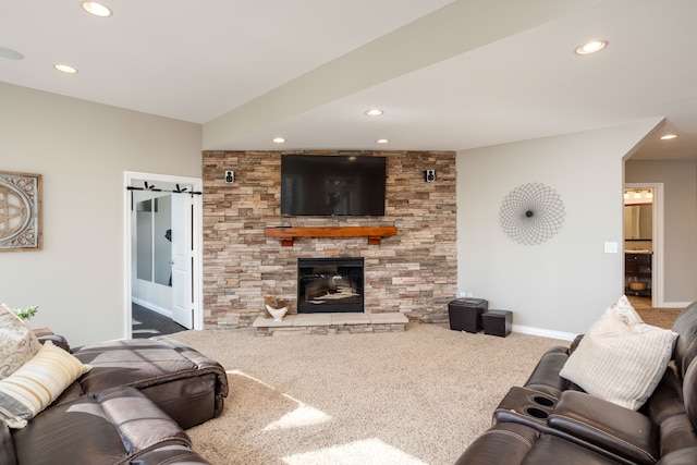 carpeted living room featuring recessed lighting, baseboards, and a fireplace