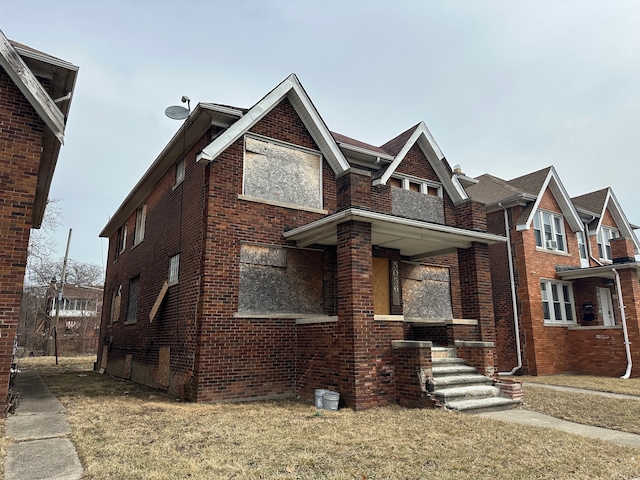 view of front of house featuring brick siding