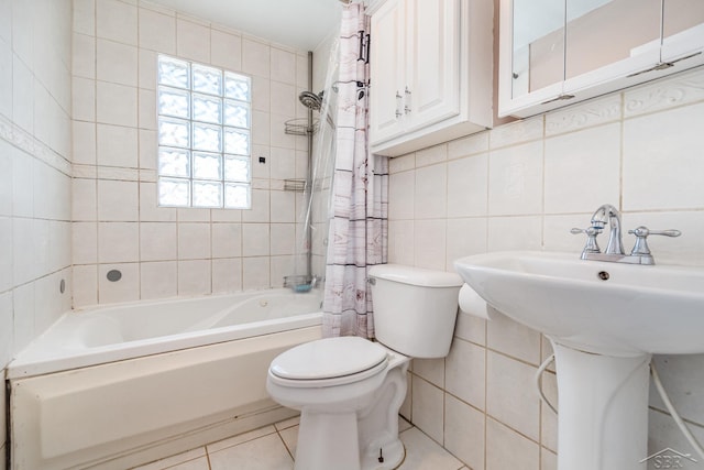 full bath featuring shower / tub combo, decorative backsplash, toilet, tile patterned floors, and tile walls