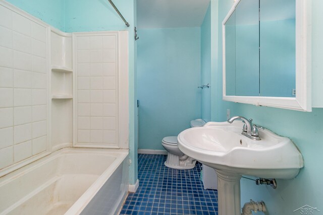 full bath featuring baseboards, toilet, tile patterned flooring, and bathing tub / shower combination