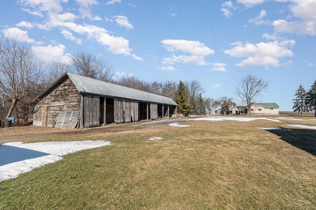 view of yard featuring a barn and an outdoor structure