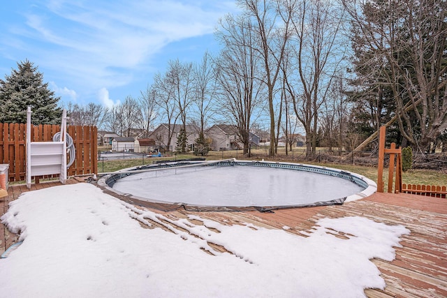 view of swimming pool with fence, a fenced in pool, and a wooden deck