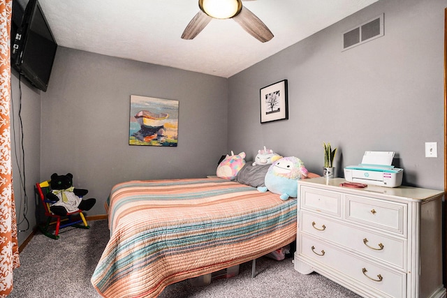 carpeted bedroom featuring visible vents and a ceiling fan