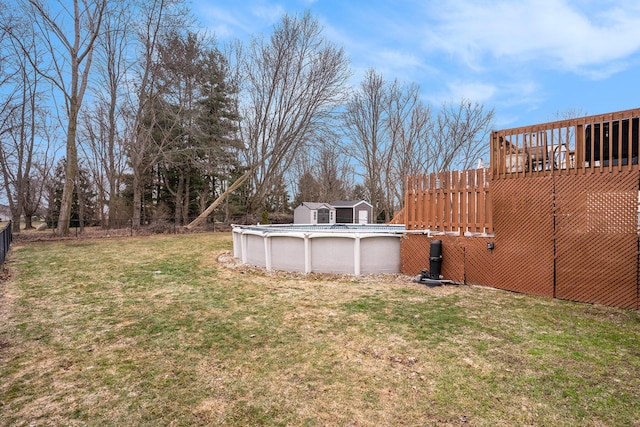 view of yard with a fenced backyard and an outdoor pool