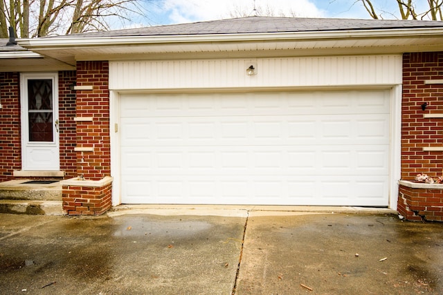 garage with concrete driveway