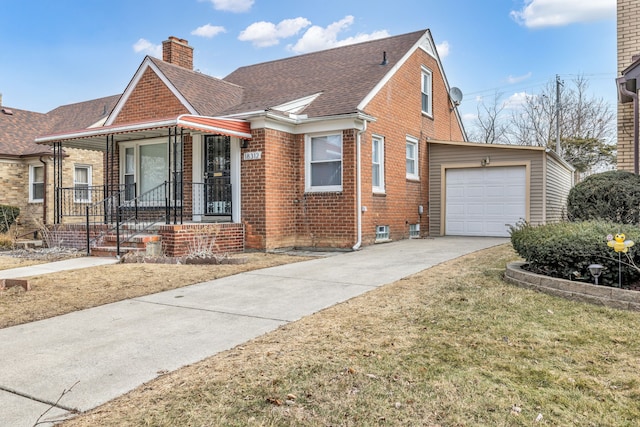 view of front of house featuring driveway, brick siding, a chimney, and roof with shingles