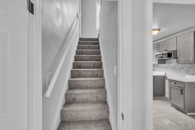 stairway with marble finish floor