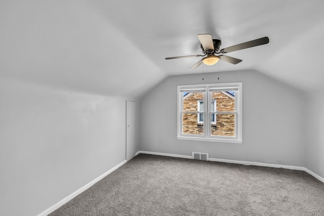 bonus room with visible vents, baseboards, a ceiling fan, lofted ceiling, and carpet